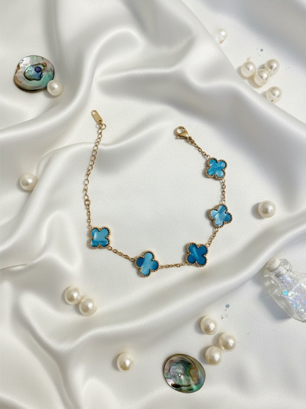 Iridescent Blue Clover Station Bracelet in Gold Tone